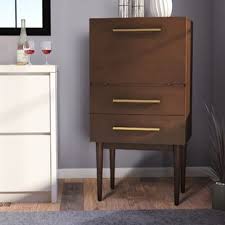 Finished in a matte black, iron cabinetry features adjustable interior shelving and multiple spaces for storage of bottles and stemware, all enclosed by clear tempered glass. Wayfair Mid Century Modern Bar Wine Cabinets You Ll Love In 2021