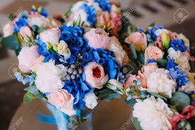 It was first brought to europe from japan, where i have right now grow thousands of species of unique flower. Three Bridal Bouquets With Creamy Roses And Peonies And Blue Stock Photo Picture And Royalty Free Image Image 96554208