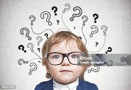 Baby Boy And Question Mark On Gray Wall Stock Photo