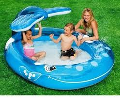 Splash And Play All Day While The Happy Whale Sprays Water To Keep You Cool Better Than A Regular Inflatable Whale Pool Intex Wha Spray Pool Pool Kiddie Pool