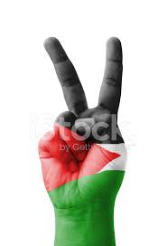 علم فلسطين‎) is a tricolor of three equal horizontal stripes (black, white, and green from top to bottom) overlaid by a red triangle issuing from the hoist. Ruka Delaya Znak V Flag Palestiny Okrasheny Stokovye Fotografii Freeimages Com