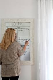 Once cut and in the frame we hung it. Diy Framed Dry Erase Board Love Grows Wild