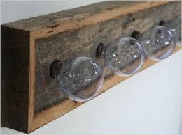 Dark walnut stain combined with bronze pipe. Angelika Kauffmann Museum Schwarzenberg At Two Small Museums With A Wooden Construction And Professional Lighting Reclaimed Barn Wood Vanity Rustic Vanity Lights Reclaimed Barn Wood