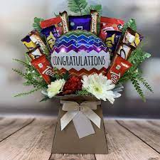 I love how she's holding the flowers and balloon. Congratulations Balloon And Flowers Chocolate Bouquet Funky Hampers