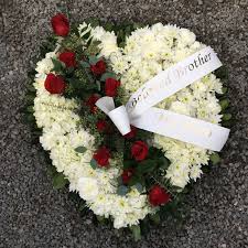 You will find more information on this. Red Rose Heart Funeral Flowers