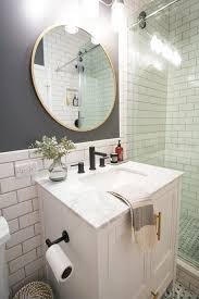 Learn how to hang the mirror and install the light fixture in this video. Revealing Our Diy Bathroom Makeover The Diy Playbook White Vanity Bathroom Diy Bathroom Makeover Small Bathroom Vanities