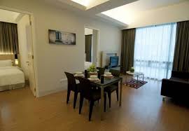 There is an outdoor swimming pool at the hotel. Swiss Garden Residences Home Facebook