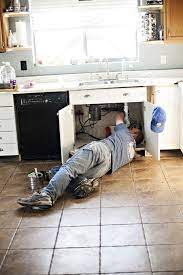 If the kitchen sink is not draining, all you have to do is turn on the faucet. Man Fixing Kitchen Sink Stock Photo 352e141c 9e08 4d94 9955 3eb8722c4d06
