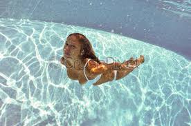 Underwater woman sienna is posing and swimming underwater in the pool. Girlfriends Underwater Portrait In Swimming Pool Stock Photo Crushpixel