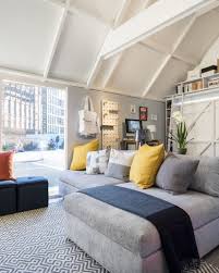 Photo of a contemporary living room in melbourne with white walls, light hardwood floors, a standard fireplace and beige floor. Houzz To Reveal Smarthouzz At Designjunction Houzz Archello