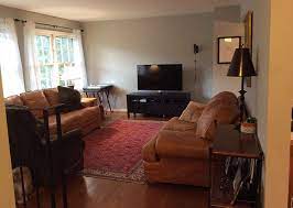 In a room with a combined living and dining area, visually dividing the space with your sofa is a good way to define your living space. Home Tour A Cramped Split Level Transforms With Spacious Mid Century Style