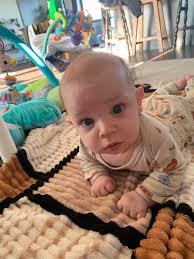 My 3.5 month old has never slept more than 2 hours she's been waking up at  5am today 4am and would only sleep till 5am if she was being rocked in my