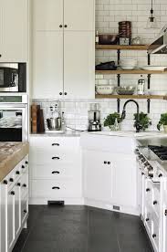 I recommend you search on pinterest for white shaker cabinets with black hardware. Black Hardware Kitchen Cabinet Ideas The Inspired Room