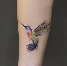 Hummingbirds, flowers and butterfly watercolor tattoo on womans shoulder, back and arm. Watercolor Tattoo Ideas Hummingbird Hummingbird Tattoo Meaning Hummingbird Tattoo Hummingbird Tattoo Watercolor