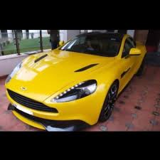 Image result for Sunburst Yellow 2012 Aston Martin