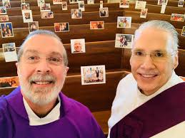 Father Mario Romero and Deacon Robert Klingman of Holy Cross Catholic  Church in the Diocese of Lafayette are still celebrating Mass with their  parishioners, or at least photos of their parishioners. Fr.