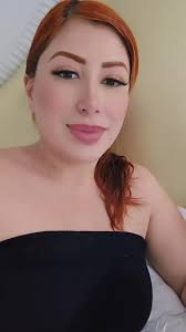 Red Hair Style Inspiration with Unique Tattoo Details