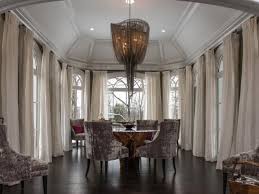 It can be described as a ceiling that angles upward on one or both sides to create volume in the room. Grand Dining Room With Vaulted Ceiling Dramatic Curtains And Chandelier Hgtv
