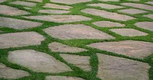 Laying artificial turf on concrete pavers is a simple, yet effective way to give your yard a fresh, modern look. Flagstone With Grass Between Stones Google Search Patio Stones Paver Patio Backyard Patio
