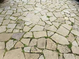 Simply clear your garden area, roll out the grass and tidy up the edges. Crazy Paving Pavingexpert