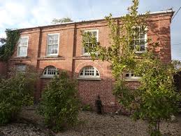 the coach house was the original coach and stable block for christmas hall it was originally converted in the 19990 s and has r house styles house coach house