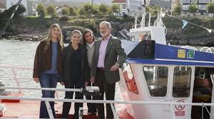 Queen Letizia falls on fishing boat during visit to Llanes