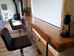 I have built the bar top of the breakfast bar. Breakfast Bar 4 Inch Thick 8 Foot Long Fir Slab Finished With Osmo Top Oil And Supported By Pintrest Worthy 3 4 Pipe Fittings The View Is The Front Road And A Graveyard