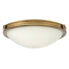 After your space is adequately lit, add some task lighting to focus on specific areas where you want concentrated light. Medium Round Flush Fit Ceiling Light In A Heritage Brass Finish