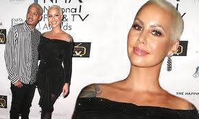 Amber Rose flaunts curves in black mini dress alongside beau at National  Film & Television Awards