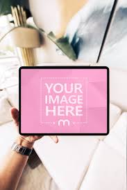 Download Man Holding Ipad Pro In Hand Mockup Mediamodifier