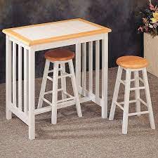 It consists of a slender table and two stools in a harmonious color palette of natural brown and gold. Natural White Tile Top Breakfast Bar Table Stool Set By Coaster Home Furnishings 139 99 Some Assembly May Be R Small Bar Table Bar Table Breakfast Bar Table