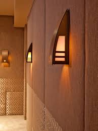 Wall lighting can be as decorative as wall art on the side of being functional. Brown Home Theater With Sconce Accent Lighting Hgtv