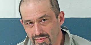 Man arrested after allegedly dragging woman out of a house by her legs