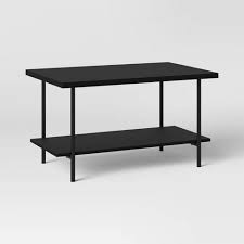 Consider positioning a long coffee table directly in front of the sofa. Wood And Metal Coffee Table Room Essentials Target
