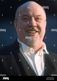 Crown prosecutor Mike Petrie smiles during a break between the reading of  impact statements by the relatives of victims of serial killer Robert  Pickton and the sentencing of Pickton by Justice James