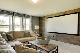 This Media Room Has A Wood Accent Wall And A Projector Screen To Create A Home Theatre This Space Is Large Yet Cozy Home Home Theater Rooms Media Room Seating