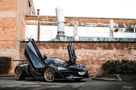 Black Car And Bronze Wheels Bronze Colored Wheels Suit This Black Mclaren 570s Perfectly Carscoops Mclaren Mclaren 570s Bronze