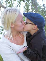 Son giving mother kiss - Royalty-free Stock Photo | Dissolve