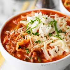 Finished Crock Pot Lasagna Soup In White Bowl Topped With Ricotta And Melted Parmesan Cheese Lasagna Soup Crockpot Lasagna Soup Recipe Crockpot Lasagna