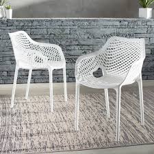 Sling patio chairs offer comfort in a stylish presentation with its relaxed design. Outdoor Plastic Patio Dining Chairs You Ll Love In 2021 Wayfair