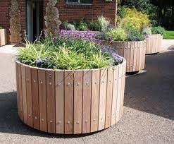 Round Timber Planter Google Search Timber Planters Backyard Garden Design