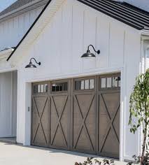 Black And White House With Wood Garage Door Beautiful Garage Door And Stain Color Modern Farmhouse Exterior Farmhouse Exterior Colors Garage Exterior