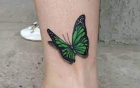 90 Best Butterfly Tattoo Design Ideas 65 91 In 2021 Butterfly Wrist Tattoo Green Tattoos Black Butterfly Tattoo