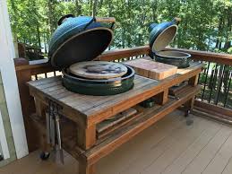 The outdoor kitchen design selects the big green egg beside the stove that lies next to the sink unit. Double Table Wood By Dana Outdoor Kitchen Outdoor Kitchen Design Kamado Grill Table