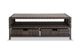 This outdoor coffee table features woodworking touches like curved side accents, plus a slatted tabletop and bottom shelf for a breezy, coastal feel (and extra storage). Montana Outdoor Coffee Table With Storage Baskets And Cover Bob S Discount Furniture