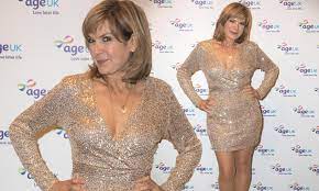 Penny Smith, 61, exudes glamour in a low-cut glittering gold mini dress at  Age UK's carol concert | Daily Mail Online