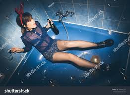 party girl sitting bathtub stock photo