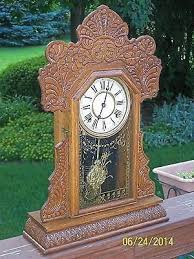 This Is A Handsome And Crisply Oak Pressed Original Ingraham 8 Day Kitchen Or Gingerbread Clock The Running Brass Works Are Vintage Clock Clock Antique Clocks