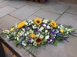 Full of beauty, radiance and happiness, nothing brightens their day quite like sunflowers. Sunflower Casket Spray Buy Online Or Call 01623 622002