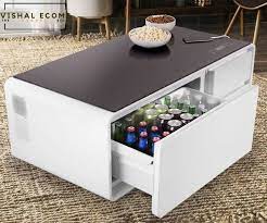 Discover a modern coffee table in luxurious finishes or browse our large selection of natural round coffee tables. Smart Coffee Table Smart Mini Bar Multi Functional Coffee Table White And Wooden Color Refrigerator High Bass Bluetooth Speakers Mobile Charger New Latest Tech Table Vishal Ecoms